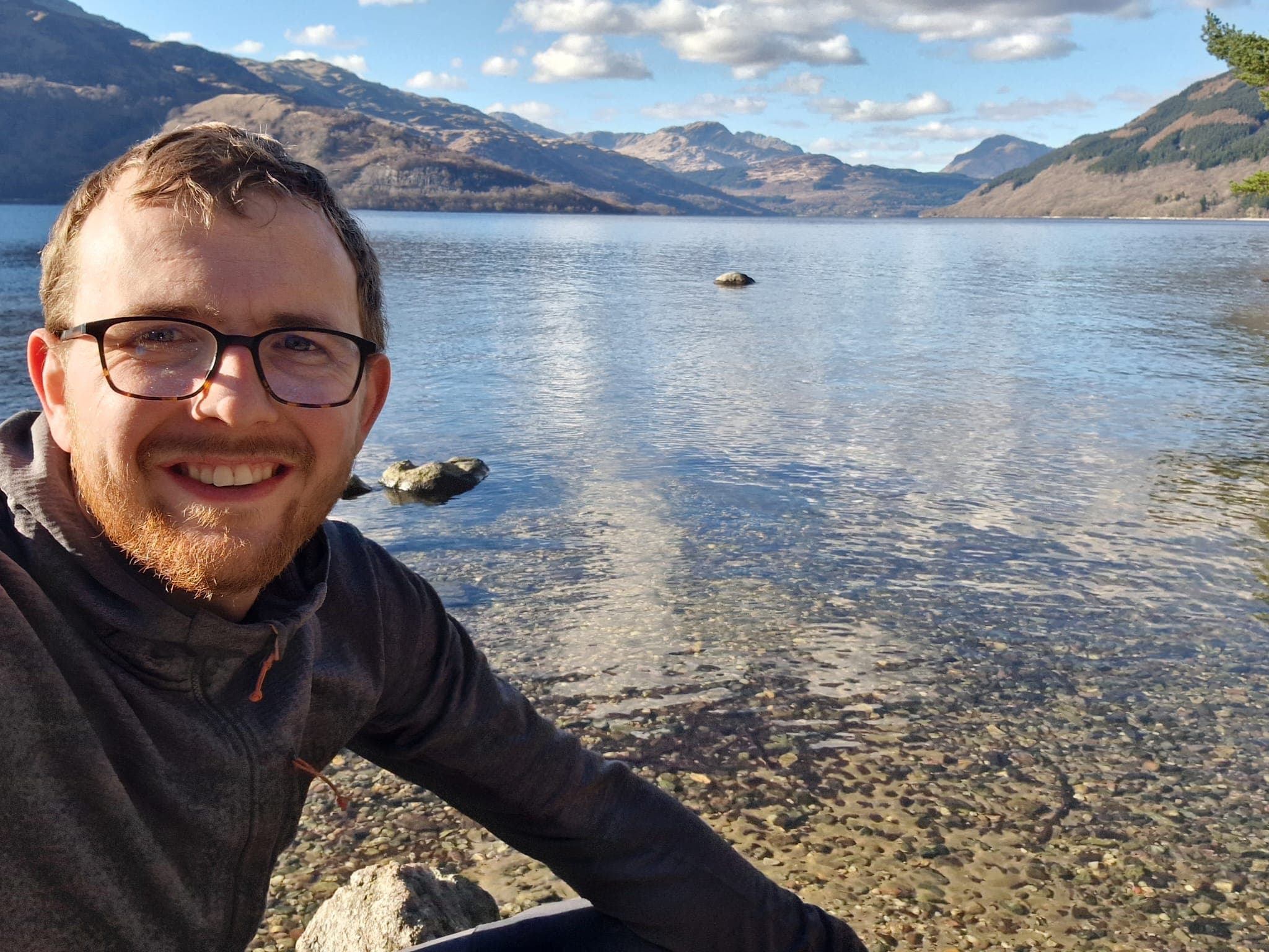 Adam next to the shore of Loch Lomand